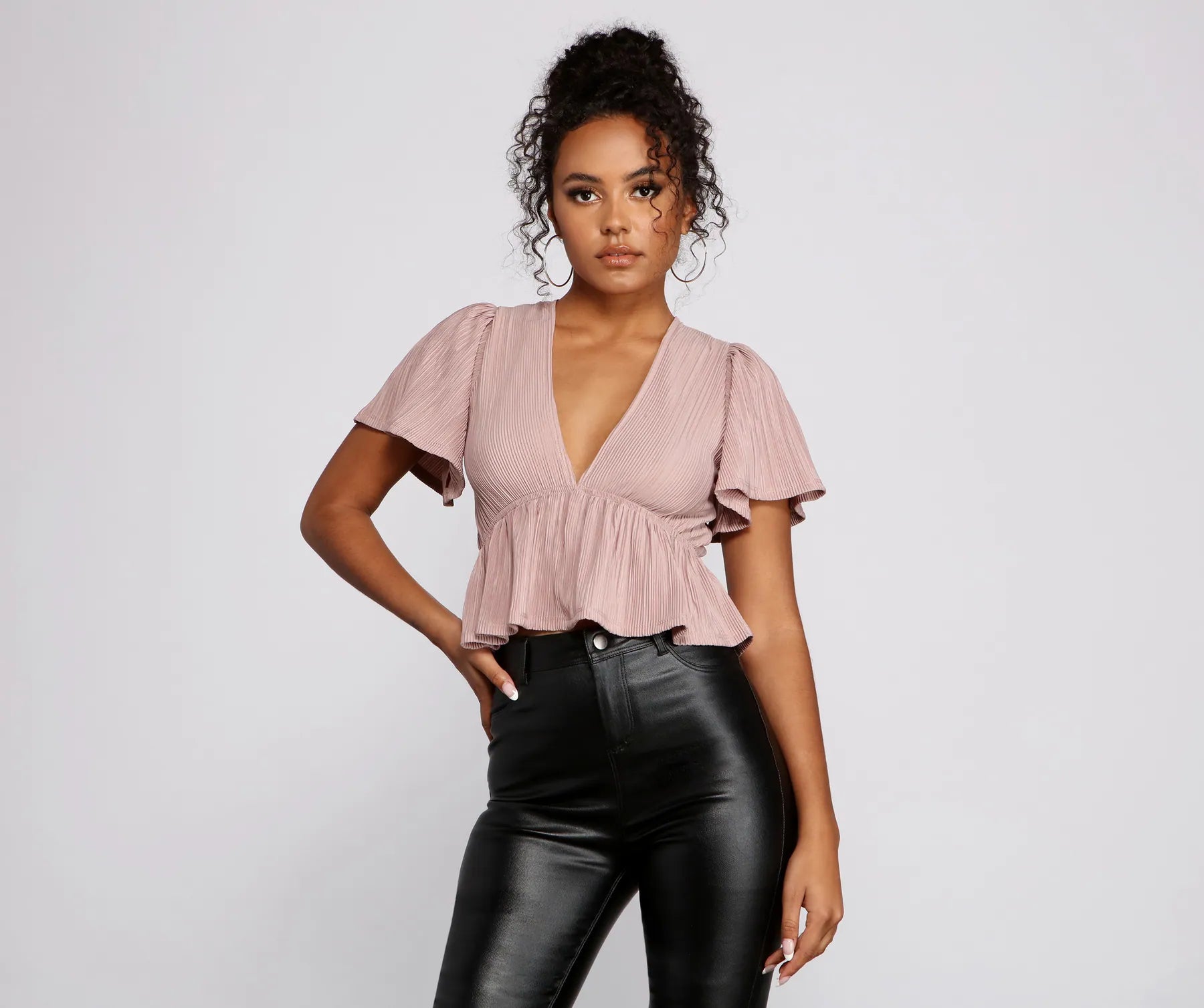 Pleated and Poised Peplum Blouse